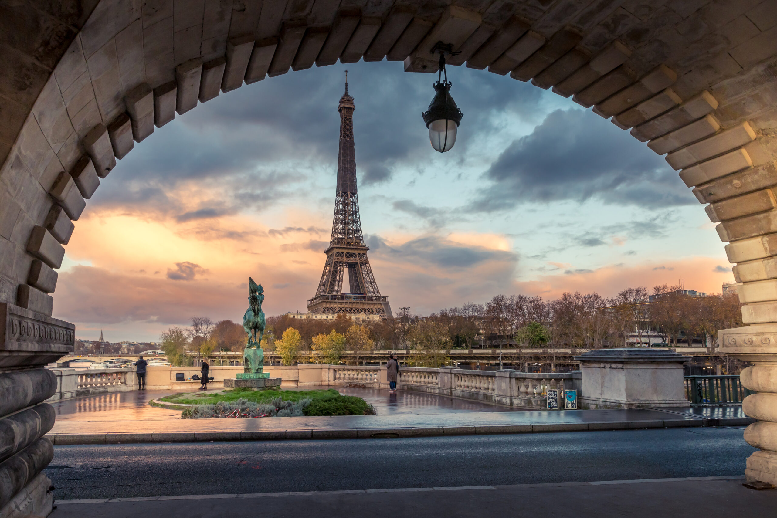 eiffel-tower-against-cloudy-sky-sunset-city