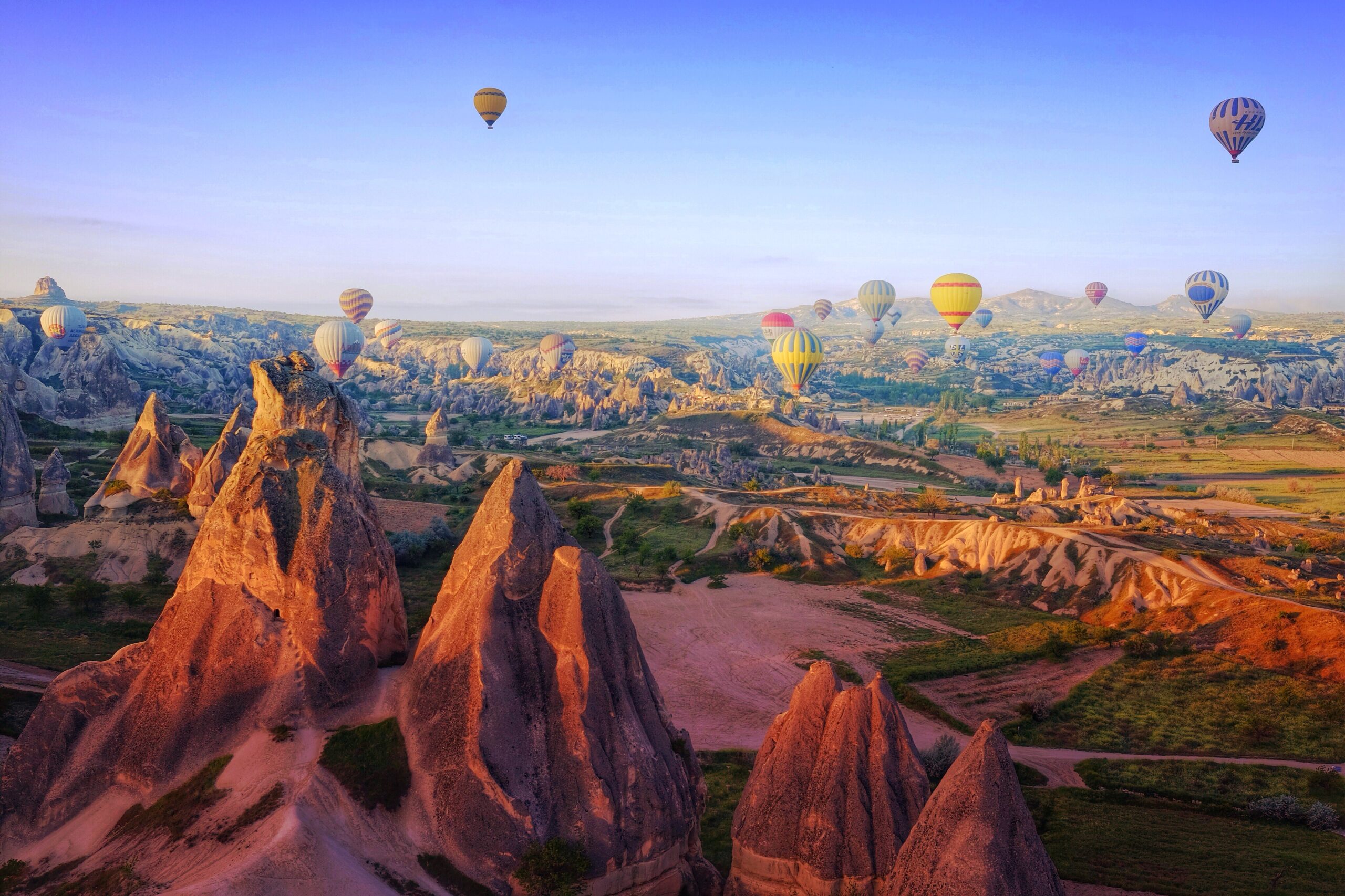 hot-air-balloons-flying-rock-formations-cappadocia